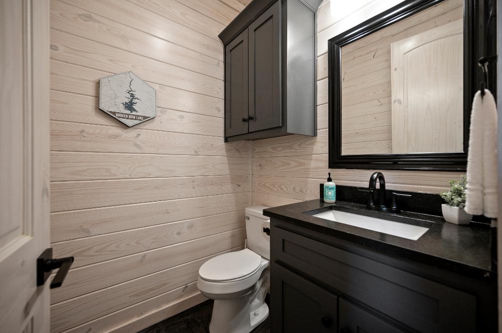 Conveniently located off the living room, this half-bath makes it easy for guests to access.