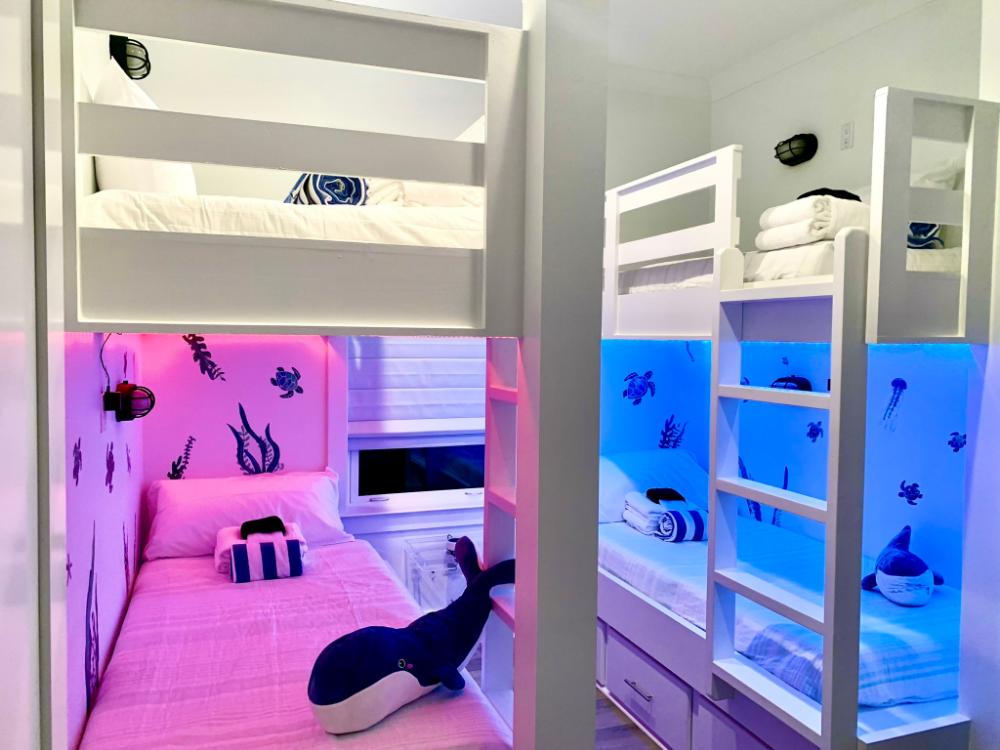 Sleepovers just got more exciting—colorful lights and under-the-sea vibes make this bunk room a kid favorite!