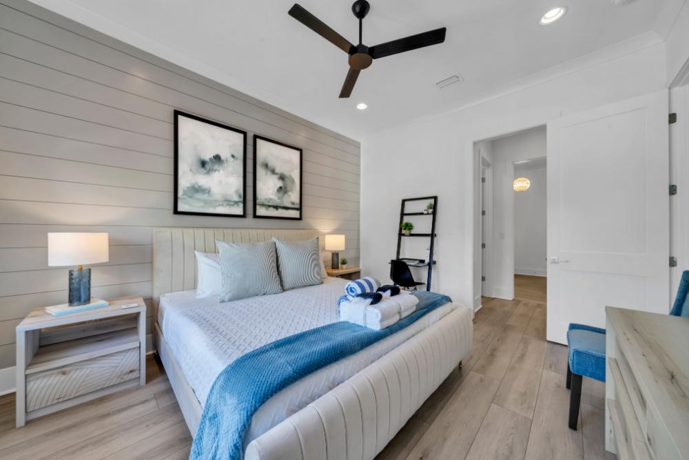 Need a little work time before beach time? The primary suite has a desk, tons of space, and a walk-in closet ready for little ones too.
