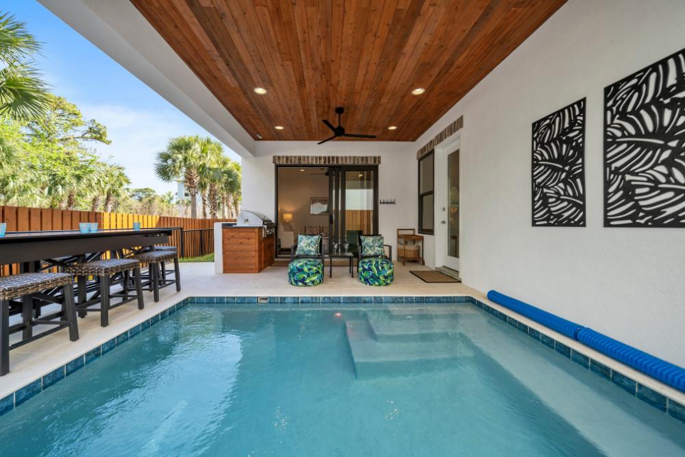 Grill, swim, or kick back with a game—this covered patio has everything for a fun-filled day in the sun (or shade!).
