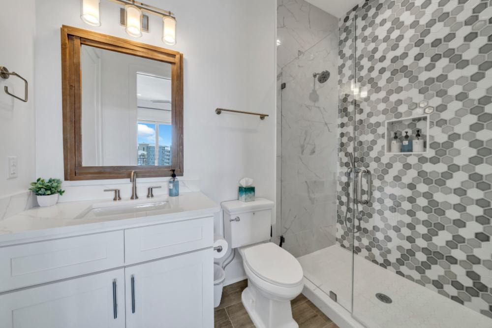 Rinse off in the modern tile shower—stocked with essentials so you can pack light and relax more.
