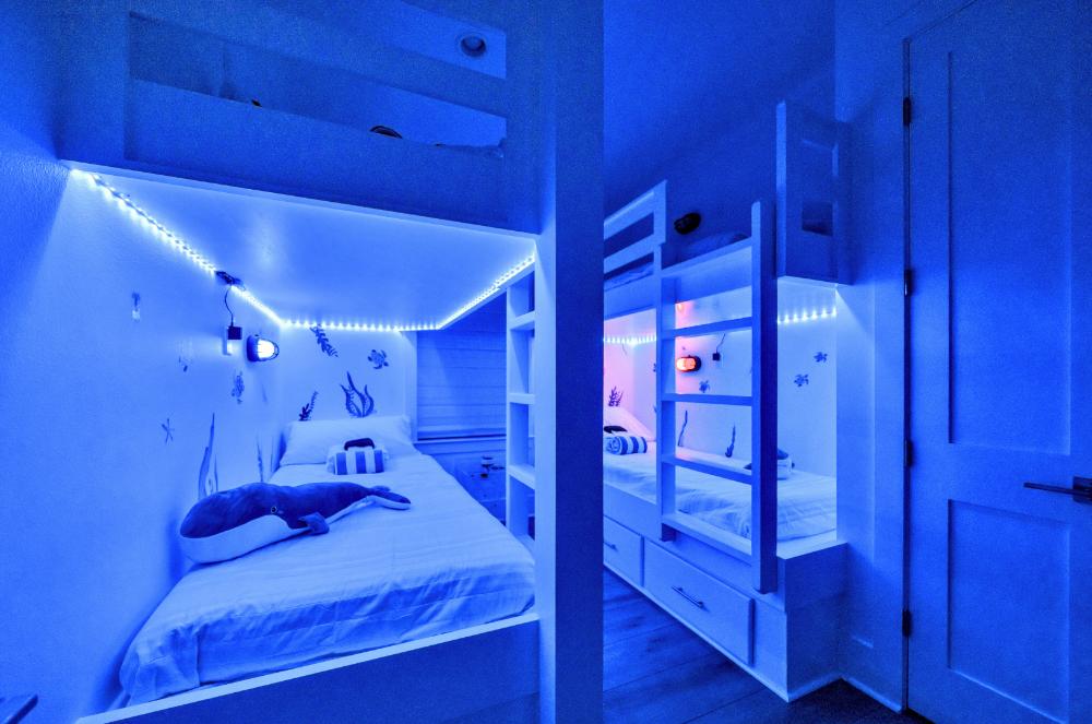 Kids will love the fun color-changing lights in the bunk room with 4 twin beds.