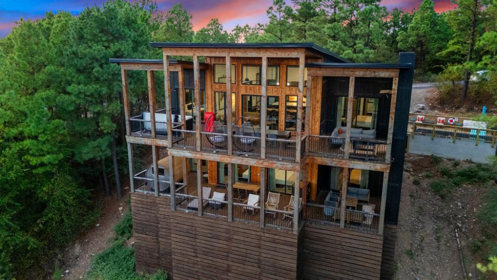 A three-story cabin tucked into the forest with expansive views, multiple decks, and the kind of privacy that lets you fully exhale.
