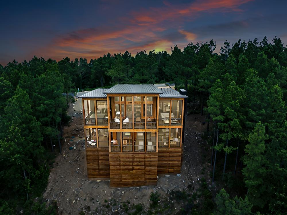 Two decks, a hot tub, a sauna, swing chairs, fireplaces, and unobstructed mountain views. The outdoor spaces here are built to be lived in.