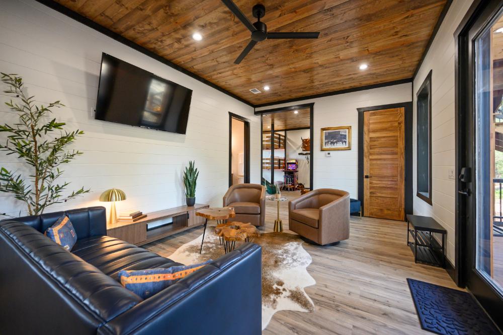A cozy lower-level living area set up for movie nights, lazy afternoons, and catching up on whatever you have been meaning to watch.