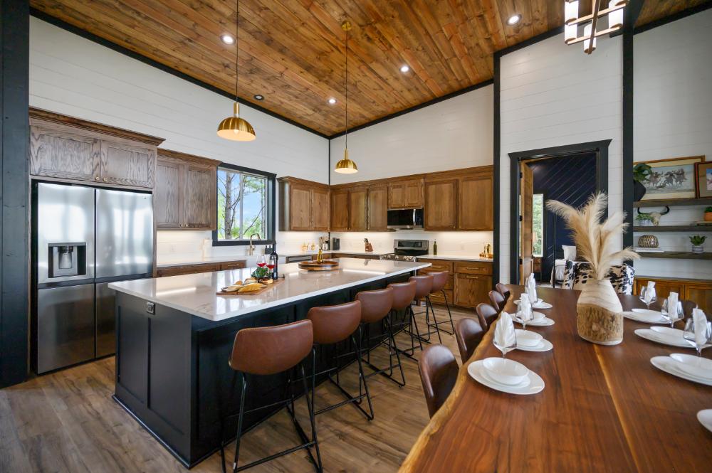 Snacks on the counter, everyone talking at once, someone telling a story. This is the spot where the trip actually happens.