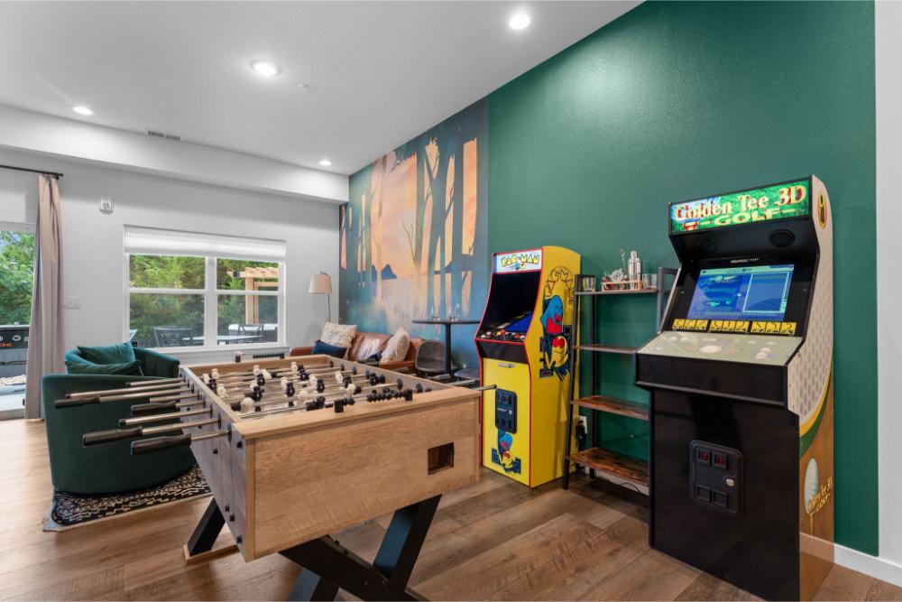 The game room is packed with entertainment, including foosball, arcade games, and a variety of board games for all ages.