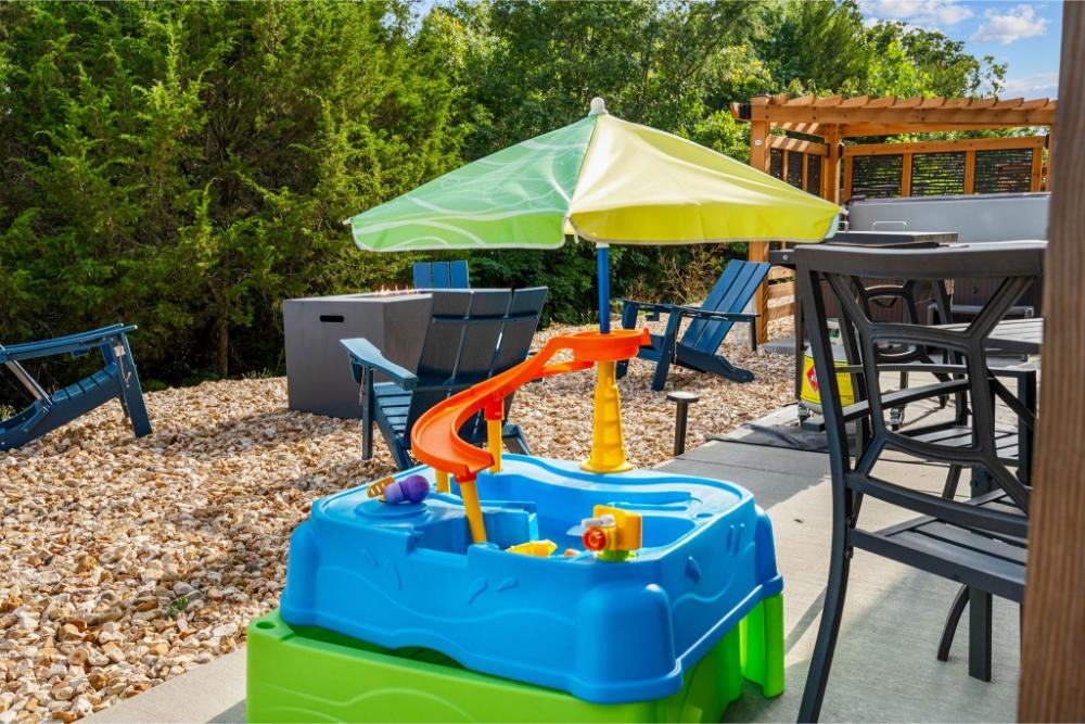 The kids get their own special spot to snack, color, and share giggles while still being close to the grown ups. It makes mealtime easy and fun for everyone.