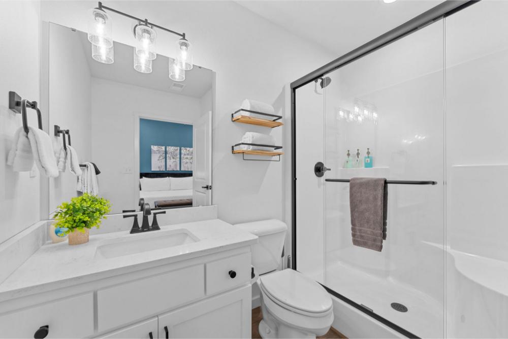 Stretch out in a spacious king bed and enjoy having your own private bathroom. It is your personal retreat after a day on the lake.