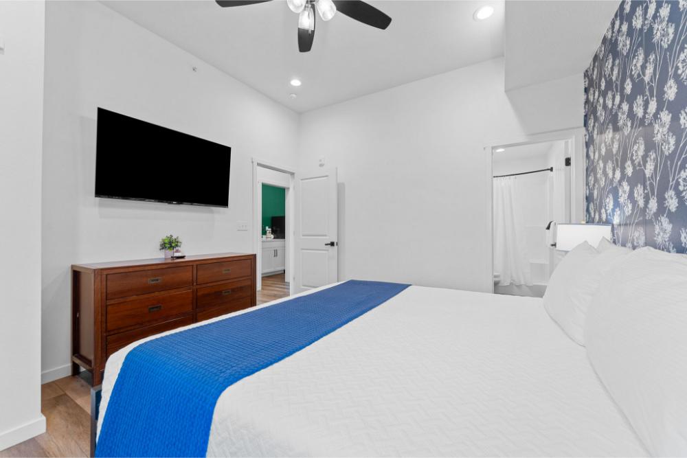 Unwind with your favorite shows from the comfort of bed and enjoy the added privacy of your own bathroom.