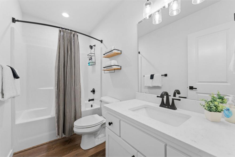Whether you are in the mood for a long soak or a quick rinse before heading out, this ensuite bath gives you both options in your own private space.