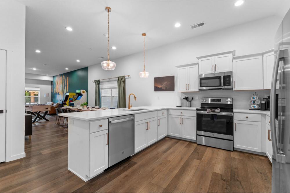 No one misses a moment here. Cook, play, and chat all in one airy space that keeps the whole group together.