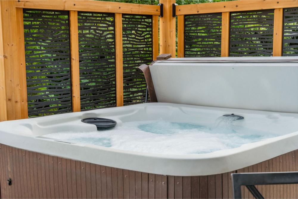 Relax and recharge in your private hot tub while enjoying peaceful lake views all around.