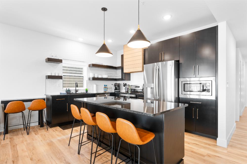 Modern kitchen fully stocked for preparing meals, snacks, and group gatherings.