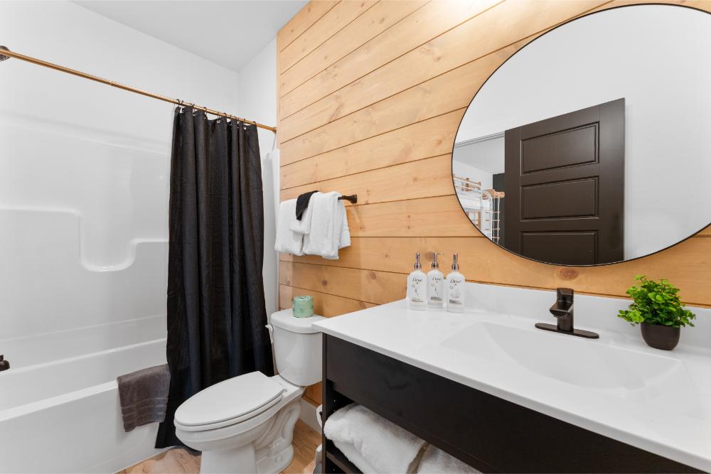 A bright and comfortable bathroom with stylish details and plenty of space to refresh.