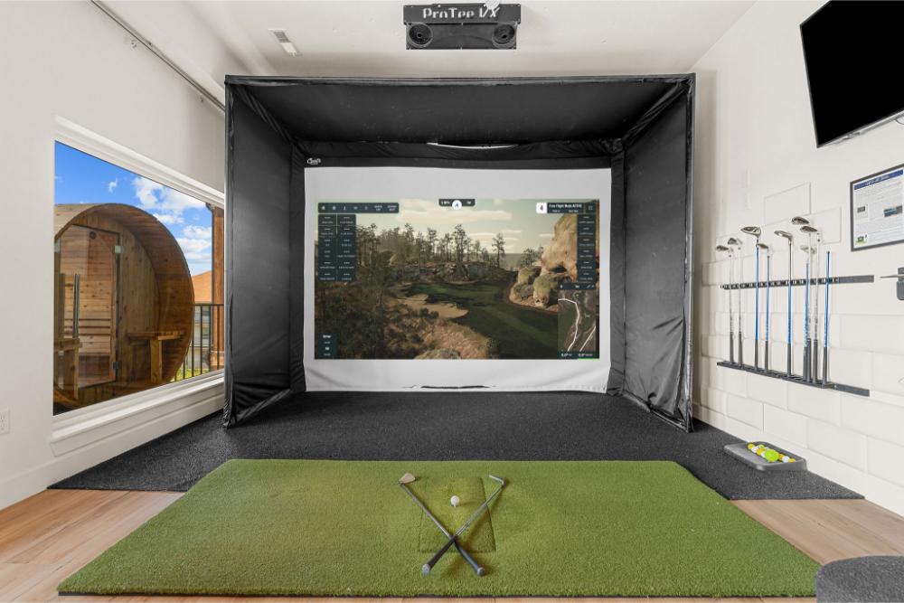 Golf simulator featuring virtual access to renowned golf courses.