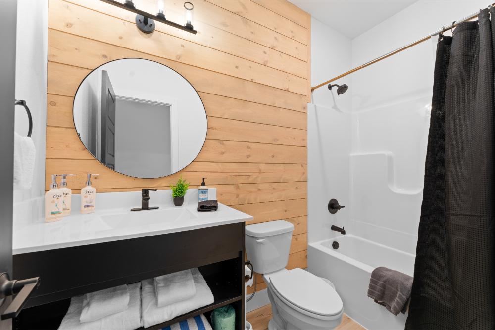 This bathroom offers both a relaxing soak and a convenient space to refresh after the day.