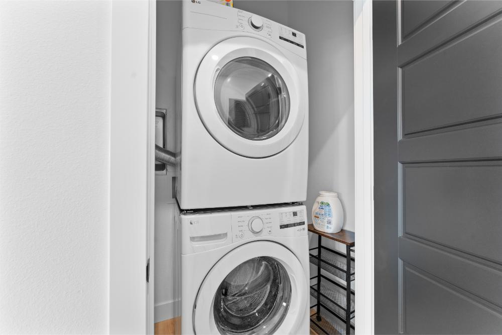 Laundry area with washer and dryer available for guest use.