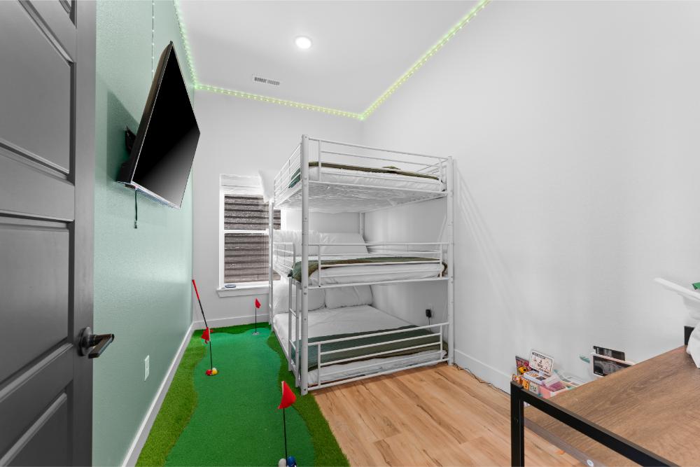 Family-friendly bunk room with themed décor, entertainment, and multiple sleeping spaces.