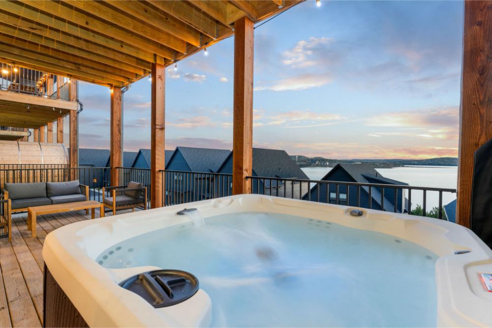Enjoy peaceful lake views from the deck while relaxing in the private hot tub or unwinding in the barrel sauna.