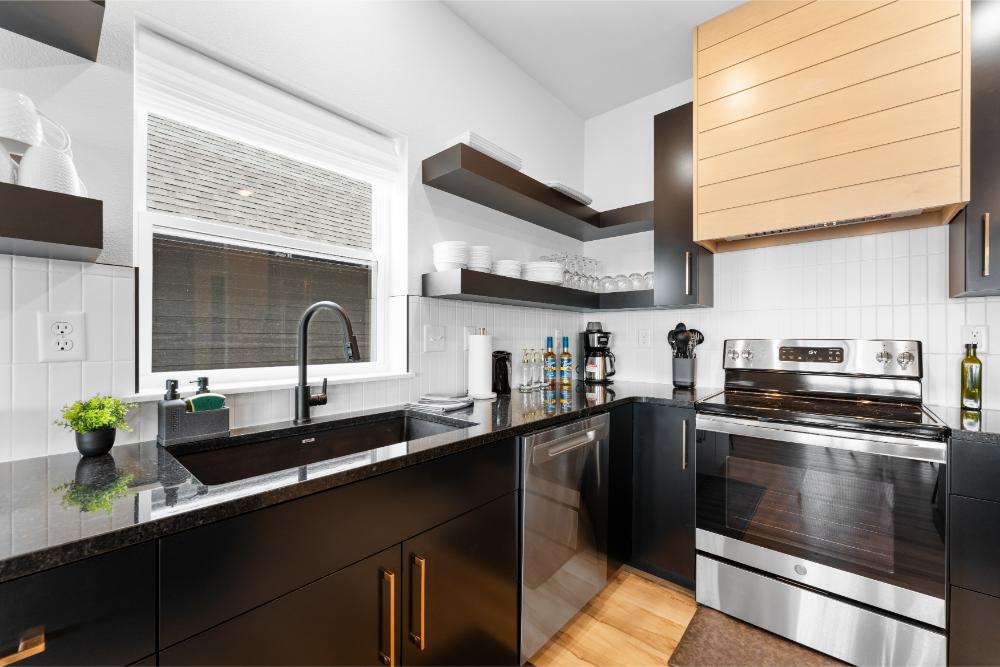 Fully equipped kitchen features premium appliances and everything needed for preparing group meals.