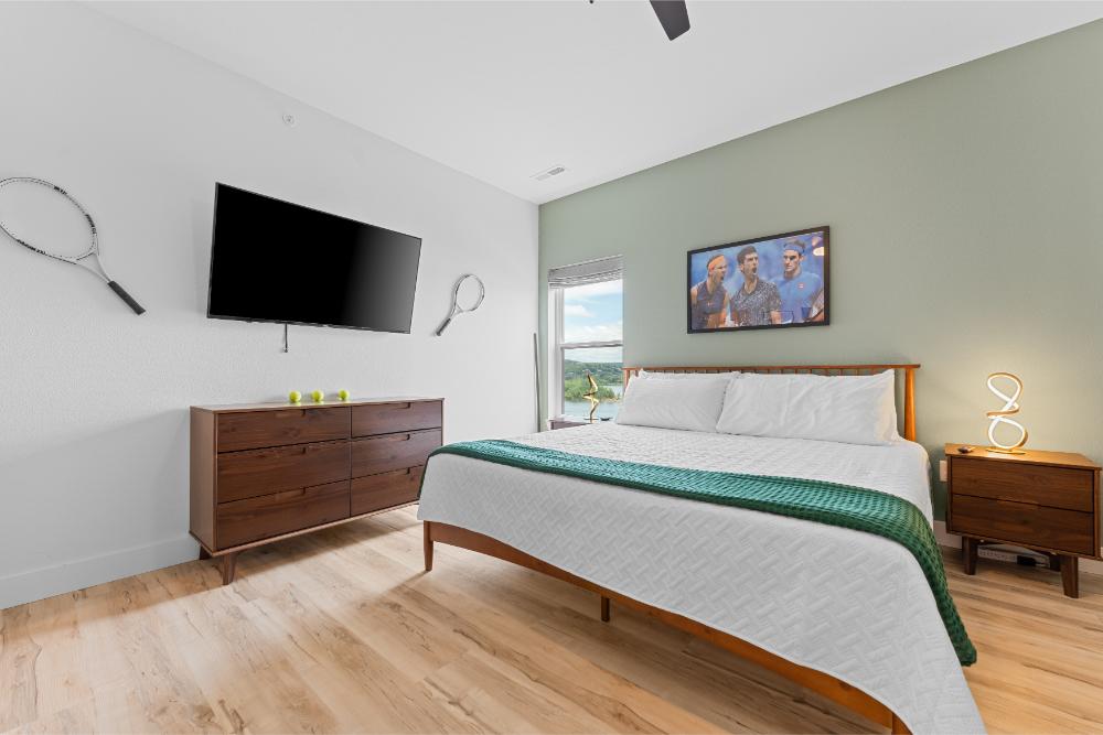 The Tennis GOAT Room features a king bed, private ensuite bathroom, and sports-inspired design accents.