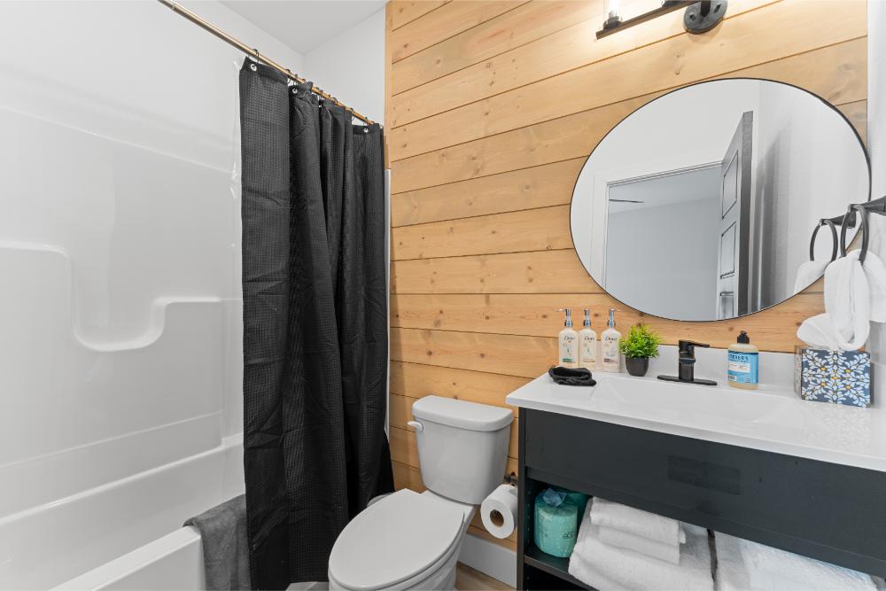 Private ensuite bathroom features a soaking tub and shower combination for a relaxing end to the day.