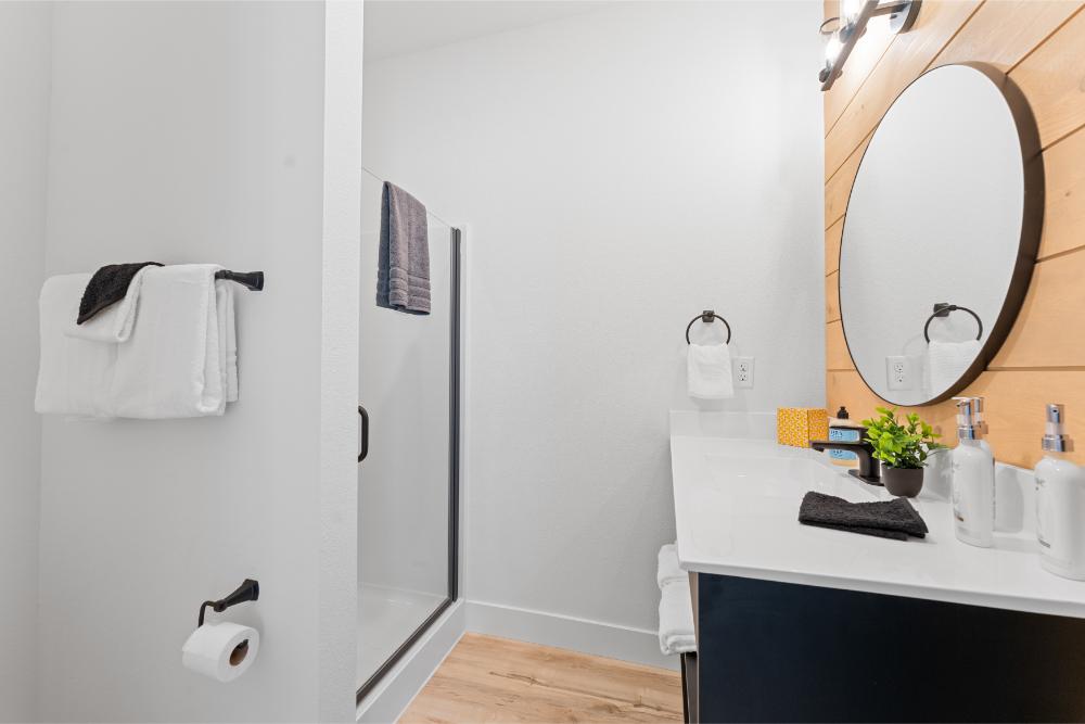 Private ensuite bathroom includes a refreshing shower, perfect for starting the day or unwinding in the evening.
