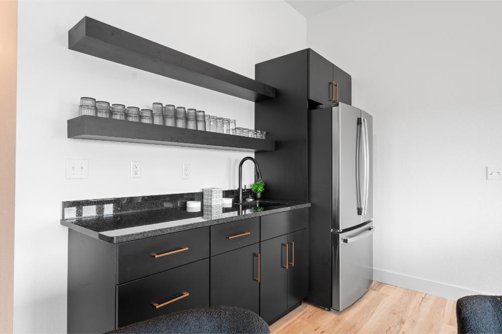 Downstairs wet bar offers generous counter space and a convenient setup for drinks, snacks, and gatherings.
