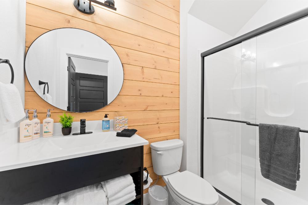 Lower-level bathroom provides convenient access for guests enjoying the downstairs living and entertainment areas.
