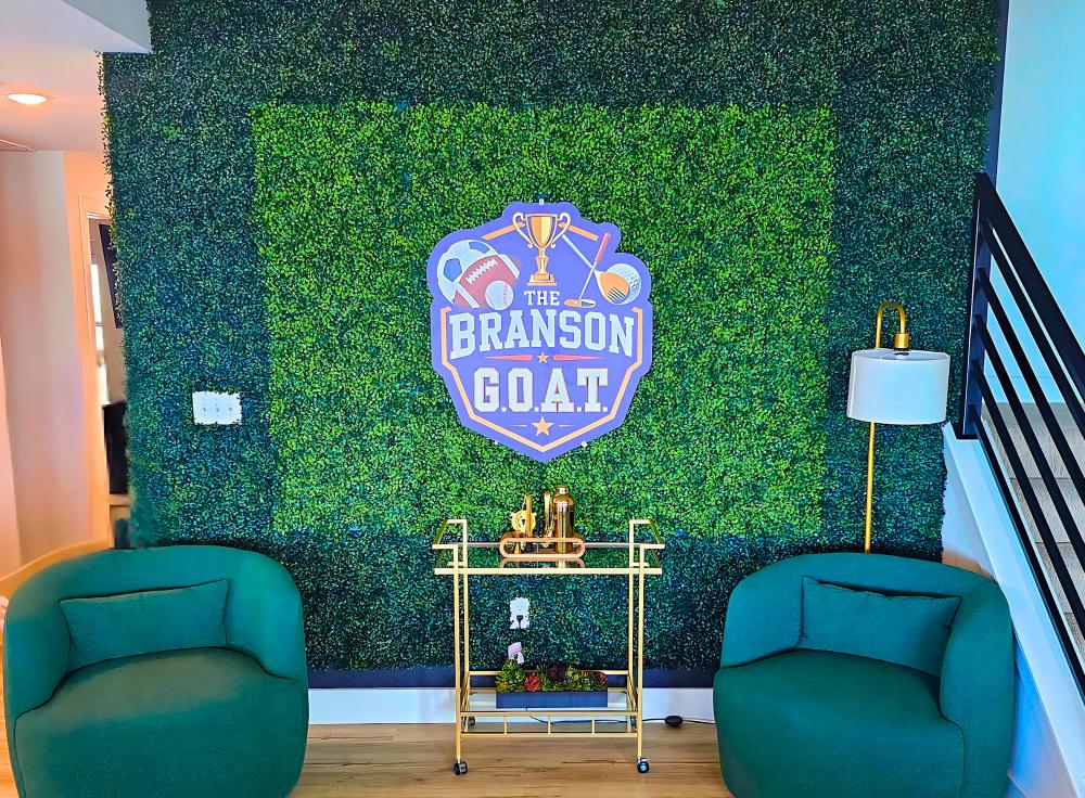 The Branson G.O.A.T. features an open-concept living area and nine uniquely themed sports-inspired bedrooms.