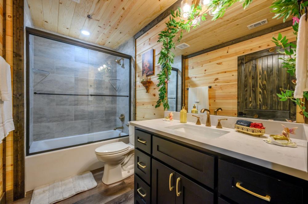 Spacious and convenient, this upstairs bathroom is ideal for getting ready or relaxing.