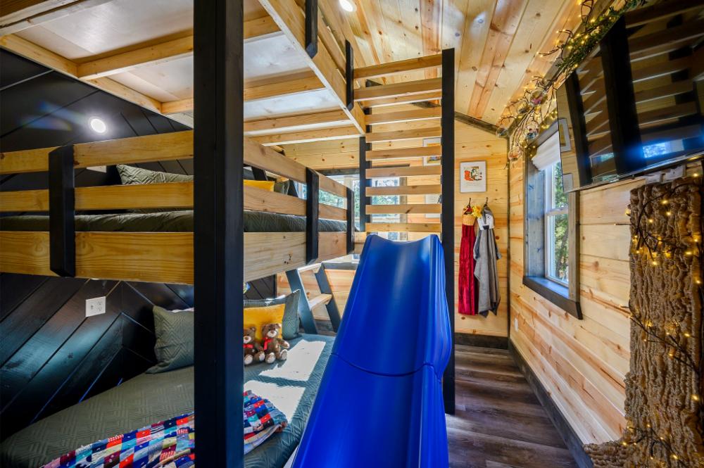 Children’s bunk room with themed décor and multiple sleeping spaces.