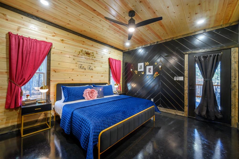 Primary bedroom with direct access to the outdoor deck.