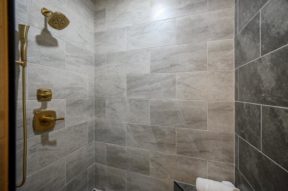 Enjoy a refreshing shower experience with extra space and dual shower heads for added comfort.