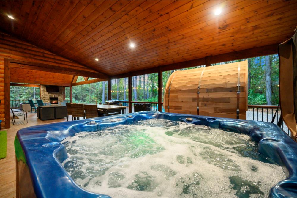 Soak in the bubbling hot tub while enjoying the covered deck, outdoor dining, and fireplace ambiance.