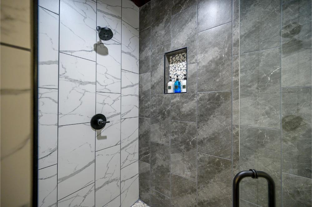 Wash away the day in this roomy tiled master shower 
