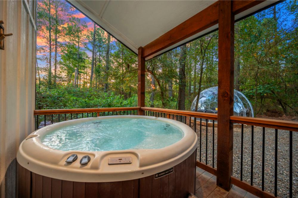 Unwind in the hot tub at dusk while the softly lit geodome adds a touch of magic to your evening.