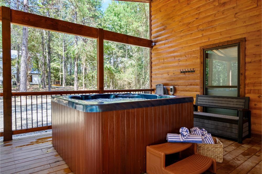 Relax and unwind in your private covered hot tub, surrounded by peaceful forest views and fresh mountain air.