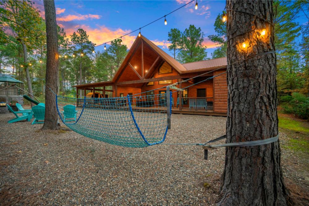 Swing gently under glowing string lights as the sun sets, creating a magical and relaxing outdoor escape.