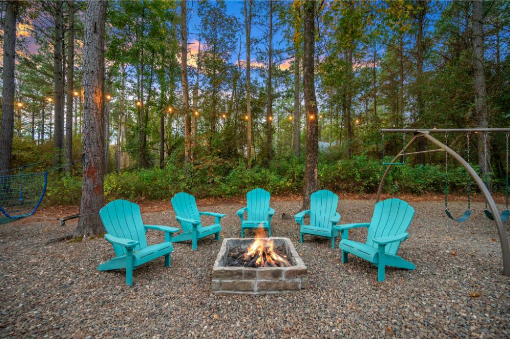 Gather around the fire pit beneath the trees for cozy evenings filled with laughter, stories, and s’mores.