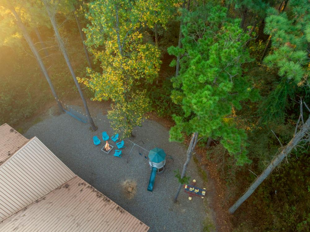 This aerial perspective highlights both cabins tucked into the trees, offering privacy and a true nature escape.