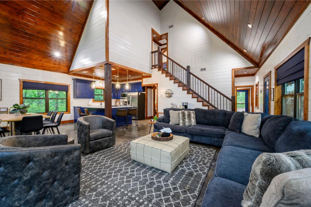 Stretch out and relax in this living space with high ceilings and seating for everyone.