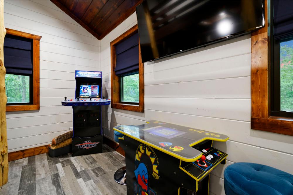 Bunk room equipped with arcade games and Smart TV.