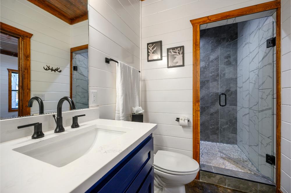 Enjoy a spacious walk-in shower, double vanity, and fresh towels for a comfortable stay.