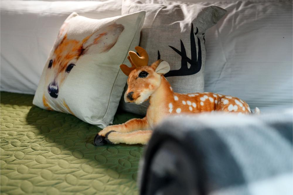 This bunk room features built-in bunks and arcade games designed with kids in mind.