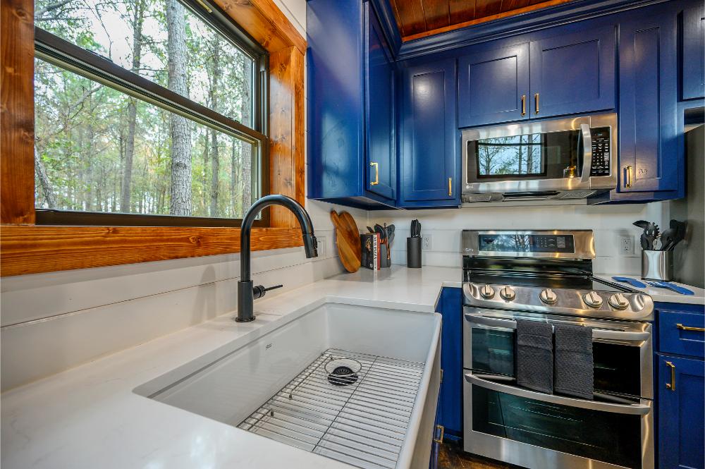 Double ovens, a spacious sink, and modern features make this kitchen ideal for preparing group meals.