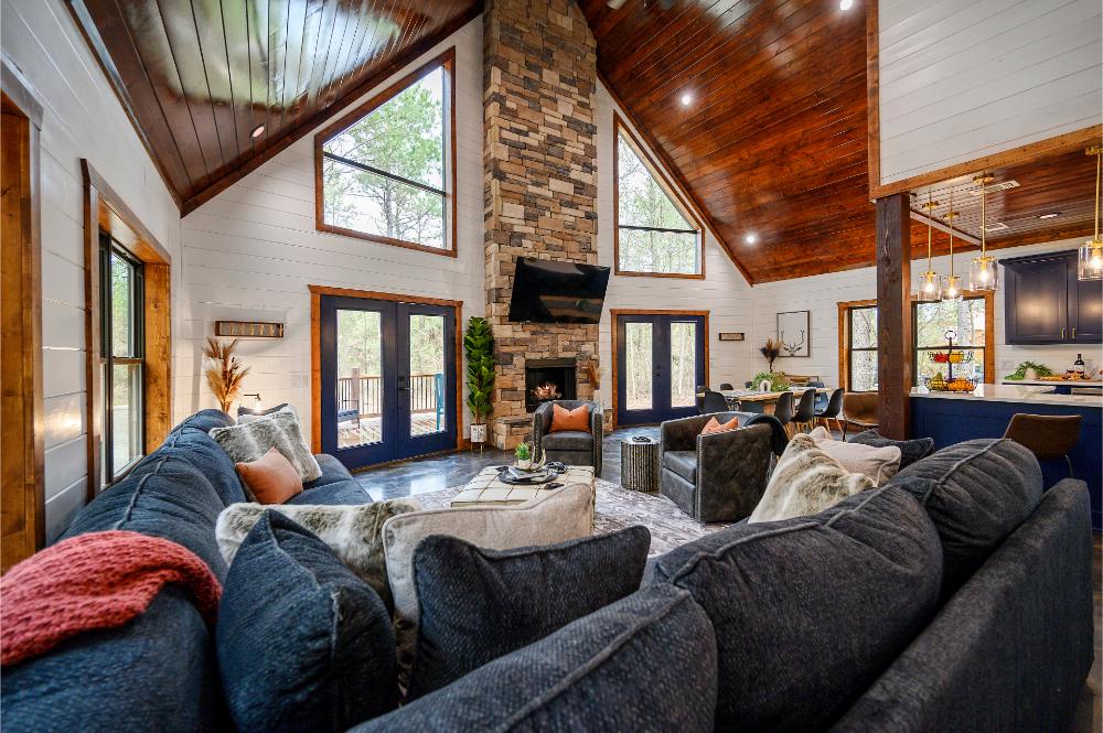 Enjoy gathering in the open living space with a fireplace, large TV, and room to cook, dine, and relax together.